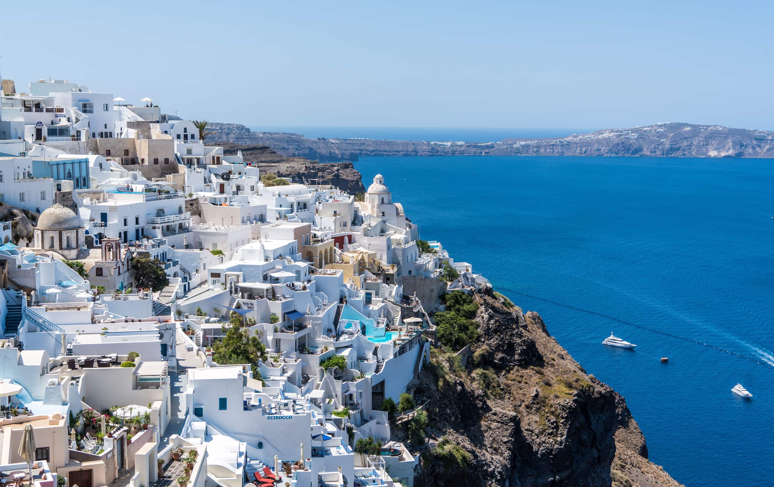 Classic view of Oia's white houses over the deep blue Aegean