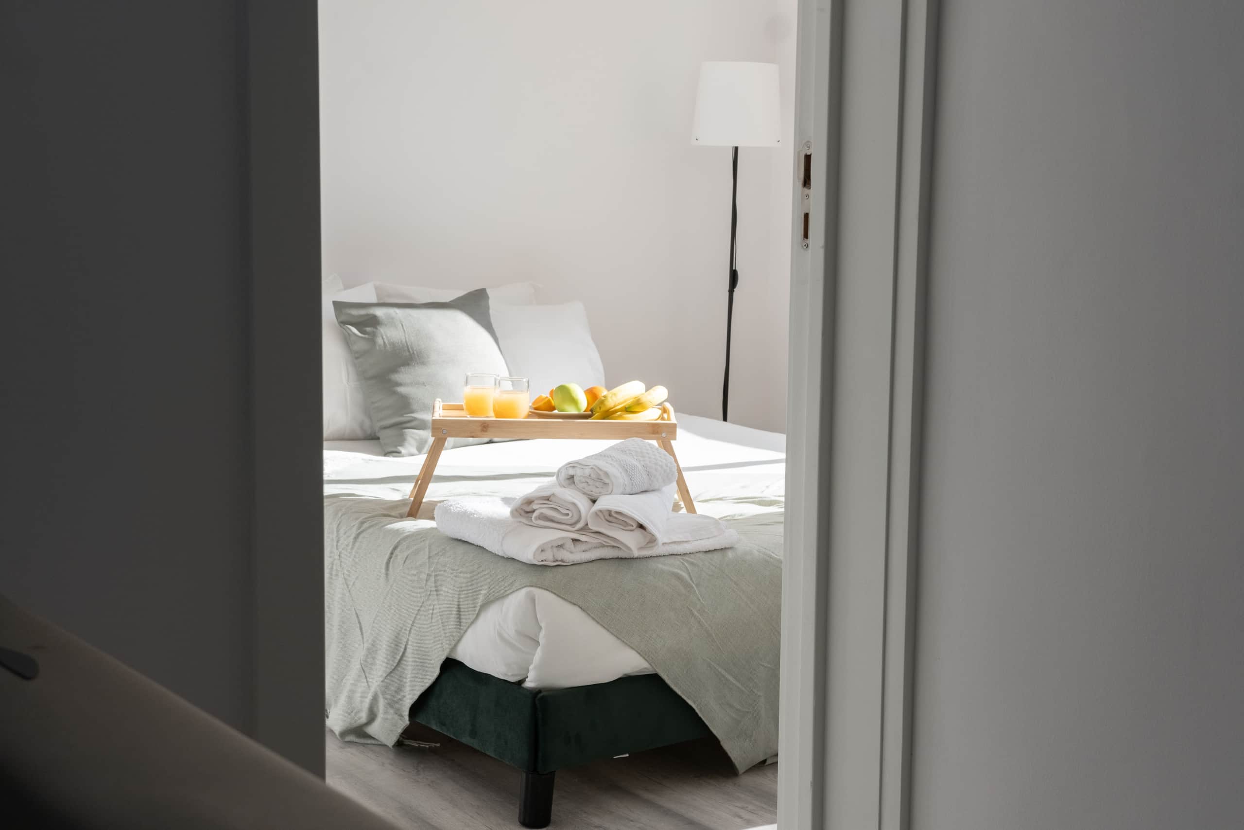 Breakfast served in bed on crisp white hotel linen