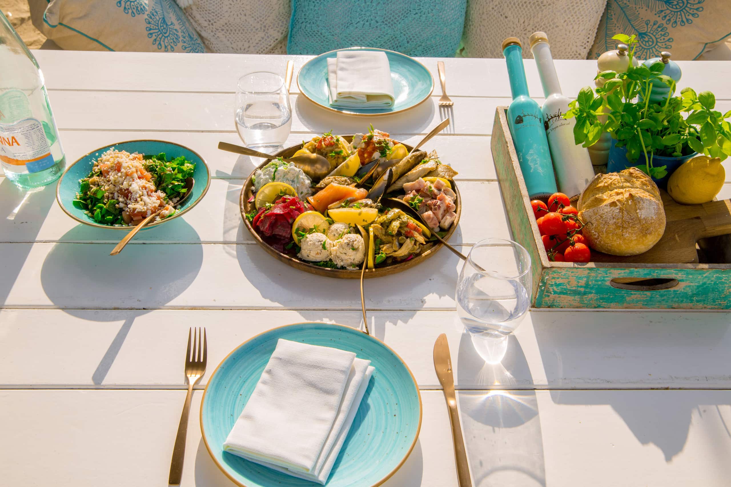 Fresh seafood platter and salad arranged on an outdoor patio table